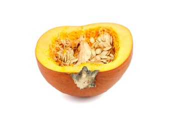 Squash with seeds isolated on white background. One halved pumpkin with orange raw flesh, selective focus