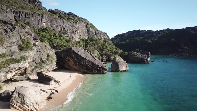 drone footage of pristine uninhabited island with bizarre tsingy rock formation and untouched paradise beach / madagascar/ nosy hara 