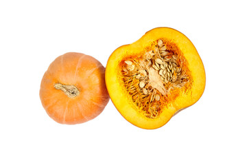 Whole and halved pumpkin with seeds isolated on white background