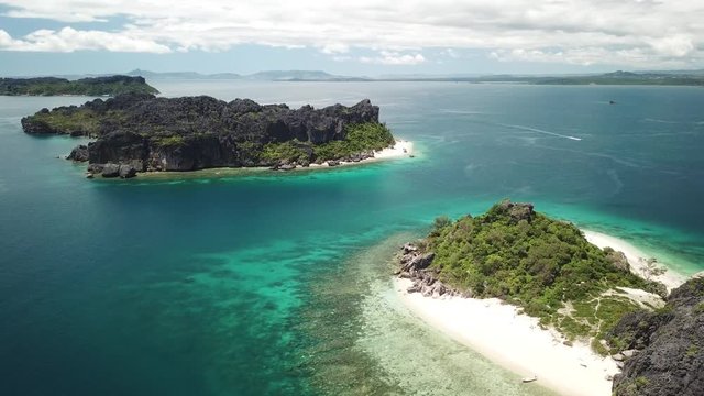 aerial drone footage of pristine uninhabited african island off madagsacar showing crystal clear water and untouched beaches/ nosy hara