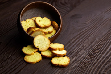 Bruschette chips, dry slices of baked bread in a bowl
