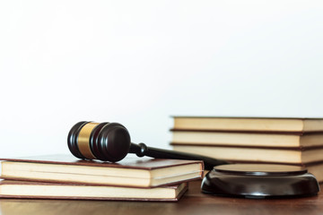 Judge's gavel and law books on white background with copy space