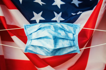 protective face mask respiratory against american flag - Coronavirus concept Pandemic in USA