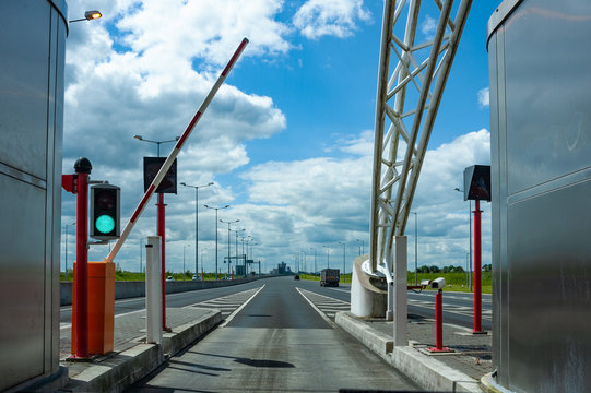 Driving through toll booth on the highway