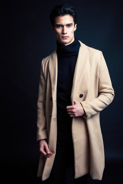 handsome asian fashion looking man posing in studio on black background, lifestyle modern people concept