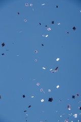Buenos Aires, Argentina; December 10, 2019: Panflets falling from a roof of a building in the assumption of Alberto Fernandez as president