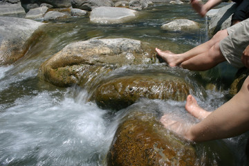 Foot washing and playing in the river