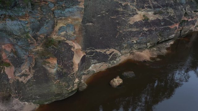 Aerial clip view on sandstone cliffs in national park Latvia. River Gauja