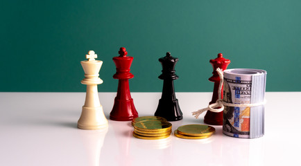 Pieces of chess and coins with strategy business concept.