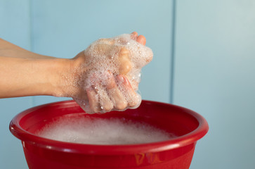 Fototapeta premium Woman washing hands with soap. 