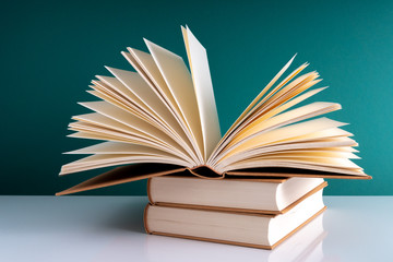 Book and green background with educational concept.