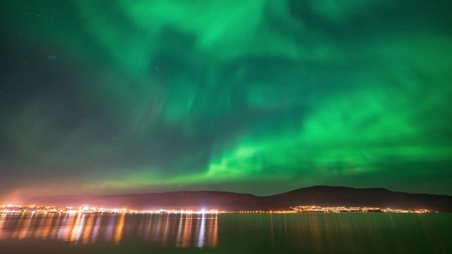Northern lights over town in autumn	