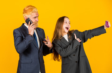 Social networks. Business communication. Mobile banking. Application online services. Internet surfing. Man and girl with smartphones. Modern communication. Mobile communication. Communicative skills