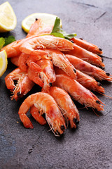 Raw fresh Prawns Langostino Austral. shrimp seafood with lemon and spices on background