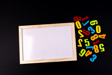 Colorful numbers on black background with educational concept.