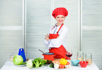 Woman enjoy cooking food. Housekeeping and culinary. Housewife prepare meal with wine. Housewife...