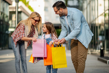 Cheerful family enjoying in shopping together