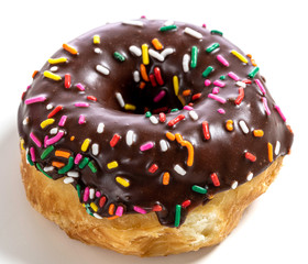 Chocolate glazed donut with sprinkles on a white background
