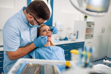 Dentist and patient in dentist office