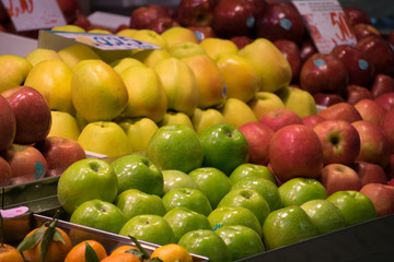 multi-colored apples in the market for sale