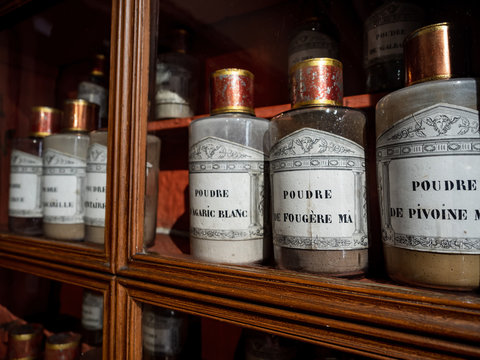 Vintage vials with ointments, infusions and powders, homeopathy. Medieval pharmacy.