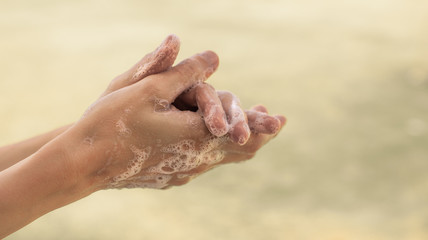 Fototapeta premium Body hygiene. Woman washing hands with soap isolated 