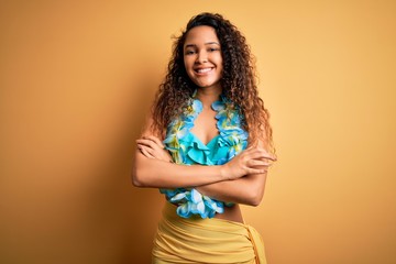 Young beautiful american woman on vacation wearing bikini and hawaiian lei flowers happy face...