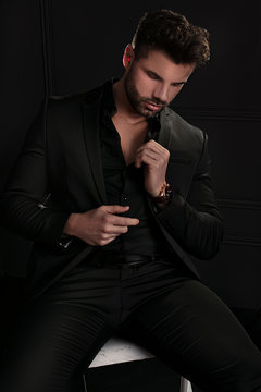 Handsome elegant man in black suit.
