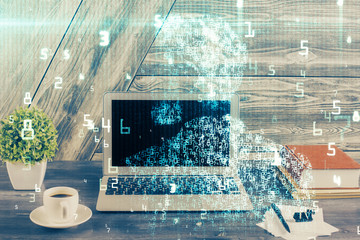 Double exposure of desktop computer and technology theme hologram. Concept of software development.