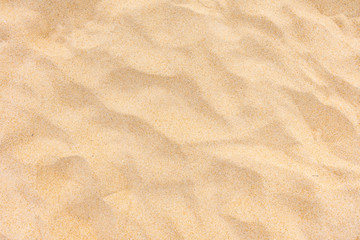 Obraz na płótnie Canvas Closeup shot of sand texture on the beach as background