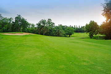 Obraz na płótnie Canvas The evening golf course has sunlight shining down at golf course in Thailand