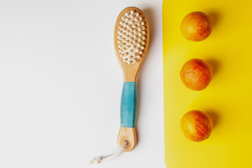 Anti-cellulite massage brush on a white background. Orange peel cellulite concept. Lymphatic drainage massage. Place for text. organic cactus brush
