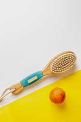 Anti-cellulite massage brush on a white background. Orange peel cellulite concept. Lymphatic drainage massage. Place for text. organic cactus brush