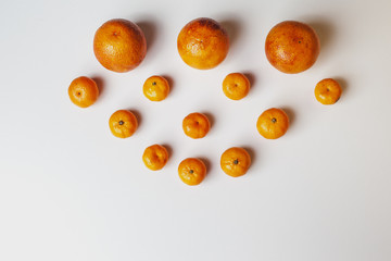  Oranges laid out in the form of arrows isolate on a white background. Fresh exotic fruits