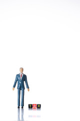 Miniature people with block TAX