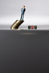 Miniature people with block TAX