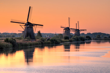 Fototapeta na wymiar Netherlands rural landscape with windmills at famous tourist site Kinderdijk