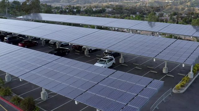 Solar panels on roof of car park, Santa Clarita, California, rising aerial