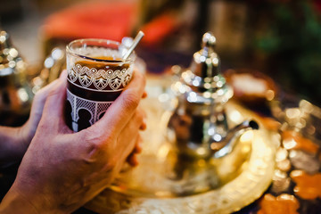 traditional Arabic tea cup, arab people drinking tea in Ramadan