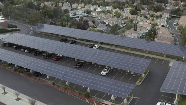 Aerial, rising, drone shot, tilting over a parking lot full solar panels, Santa Clarita, California, USA