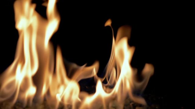 Fire inferno element on black background imploding in slow motion