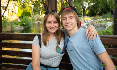 Selfie portrait of happy brother with sister in the park