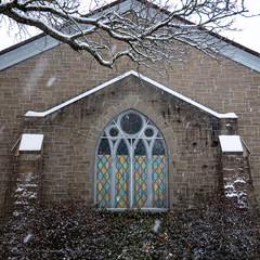 Snow and a stained glass window