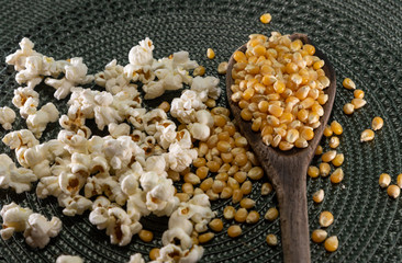 Popcorn corn grains on a kitchen table and household items
