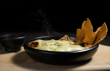 Enchiladas tortillas with nachos and cheese