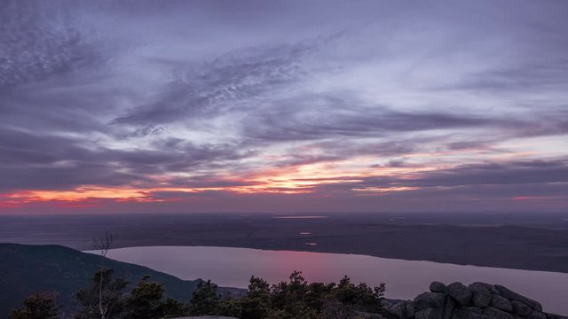 Magical sunset with reflection in several lakes in Burabay, Kazakhstan; time lapse zoom out