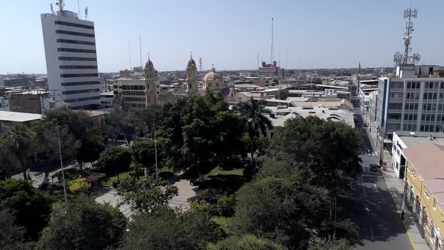 Left traveling aerial drone view move of the main square of Piura city at a sunny afternoon in Piura Region, Peru
