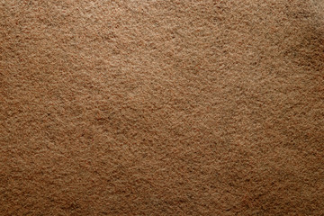 Abstract background with brown texture, velvet fabric, close-up. Colorful felt texture for background with copy space. Felt fabric sheet