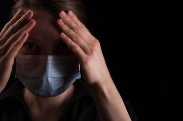 Virus epidemic, coronovirus, masked man on a black background. Mass panic, Virus in the USA, China, South Korea, Iran. Treatment and prevention of the virus. Flu, pneumonia, infection news