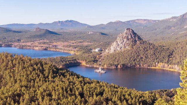 Majestic view of Blue Bay and Okzhetpes rock in autumn season in Burabay, Kazakhstan; time lapse zoom in